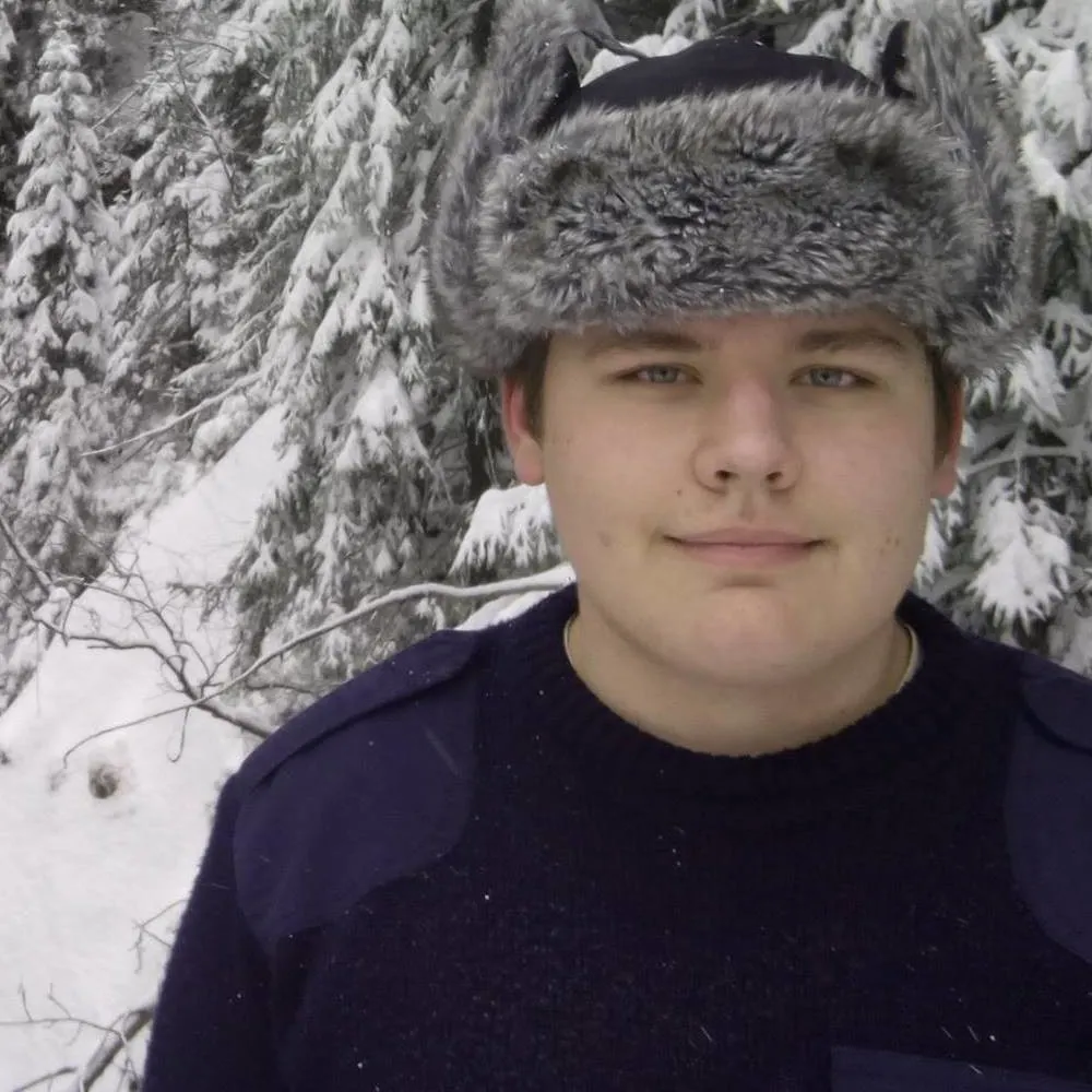 Company owner, portrait of a smiling man wearing an ushanka.